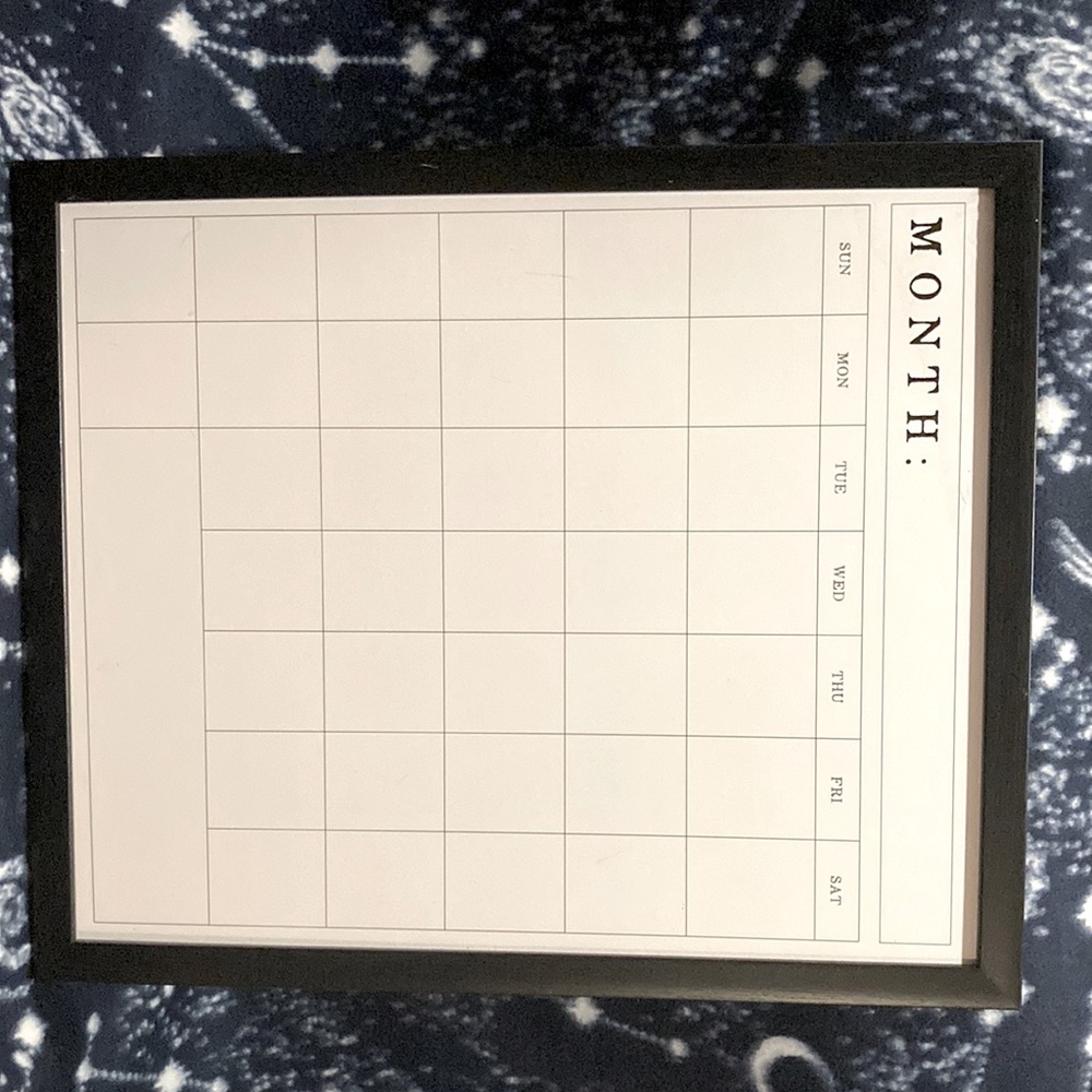I’m selling a calendar collection , black frame , wording  and all white canvas.